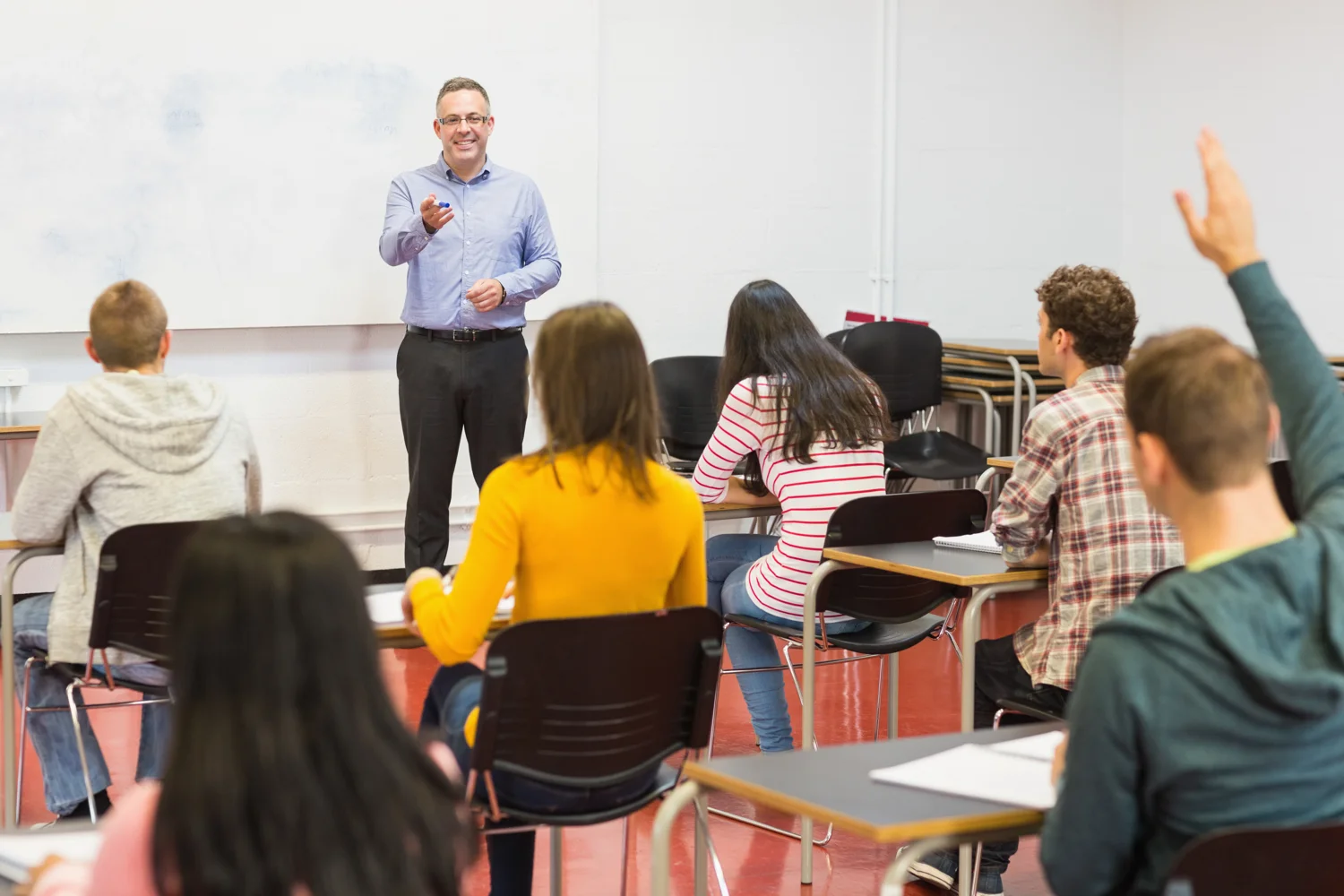 image BAC-CH-home-2-1500-photodune-12307249-rear-view-of-students-attentively-listening-to-male-teacher-in-the-classroom-xxl.jpg
