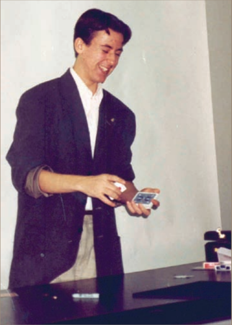 15-year-old Kostya teaching magic to a group of young magicians in New York City.