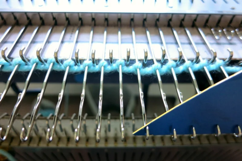 Open the latches for the first row with a cut credit card.