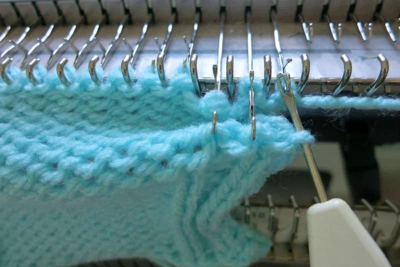 Rehang the stitches back to the needle, just like the bottom hem.