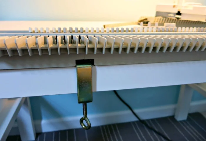 Install 2 table clamps.