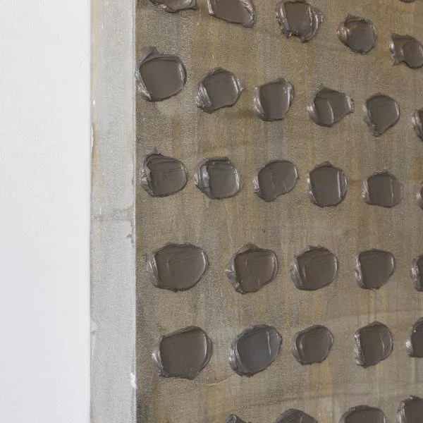 This is a side view of Kim Fonder's abstract artwork titled Visone Uno, a mixed media painting in neutral tones