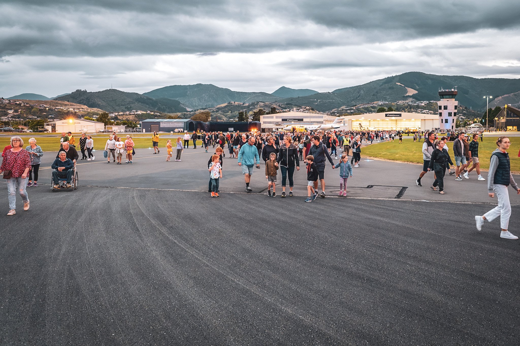 the crowd emerging from terminal onto runway.jpg