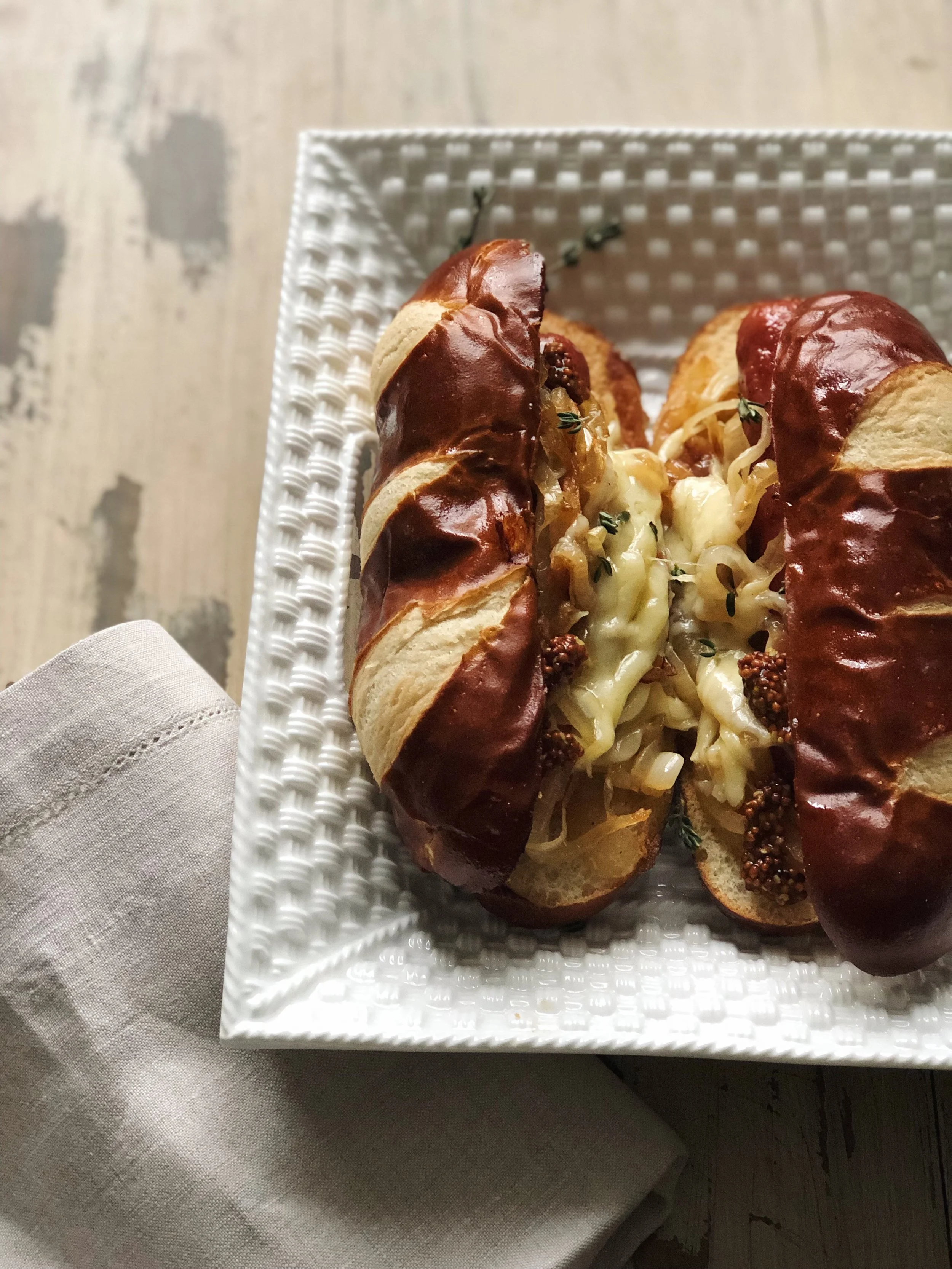 French Onion-Style Hot Dogs with Gruyere + Caramelized Onions