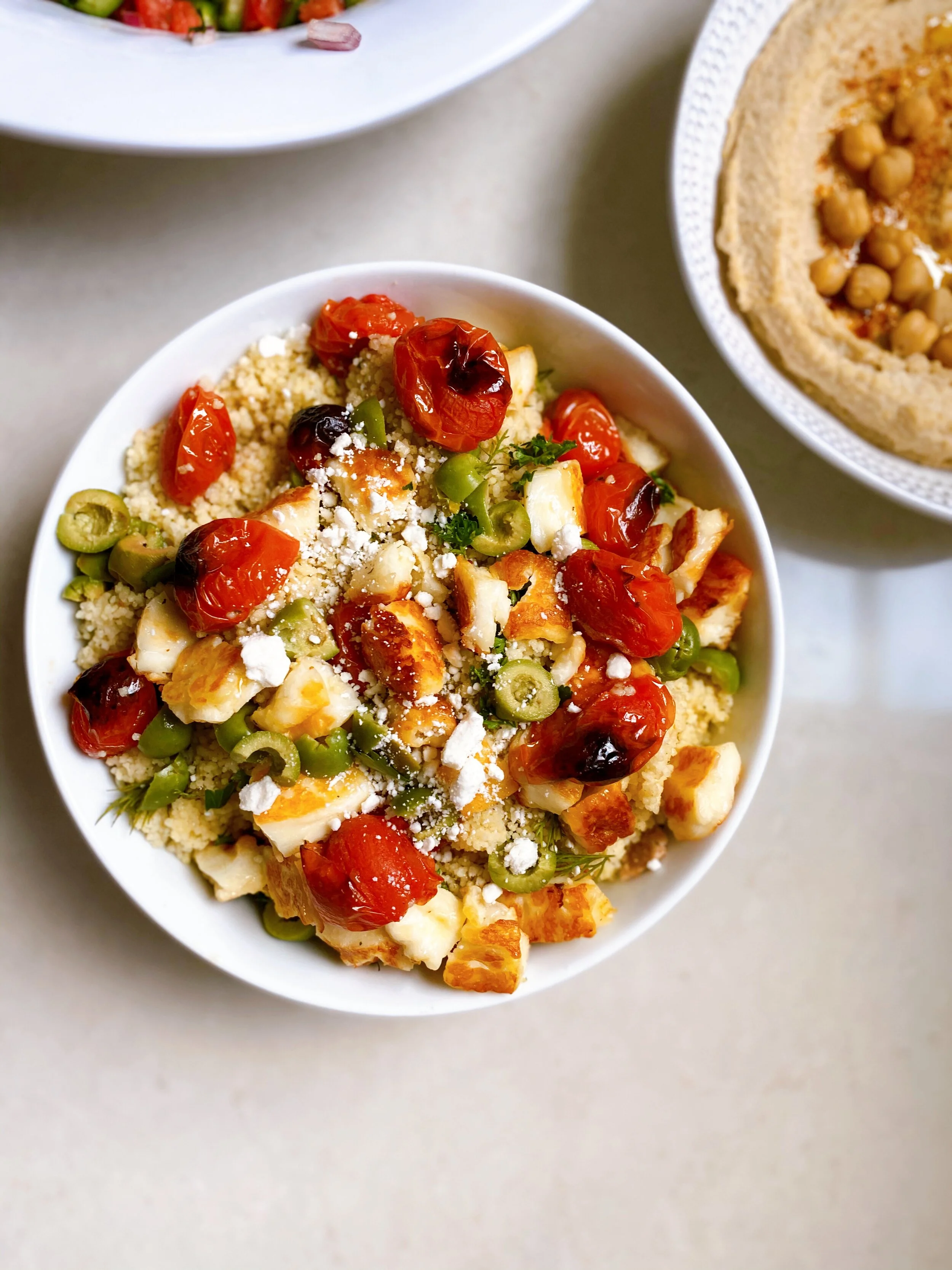 Grilled Halloumi Couscous with Blistered Tomatoes, Olives and Feta