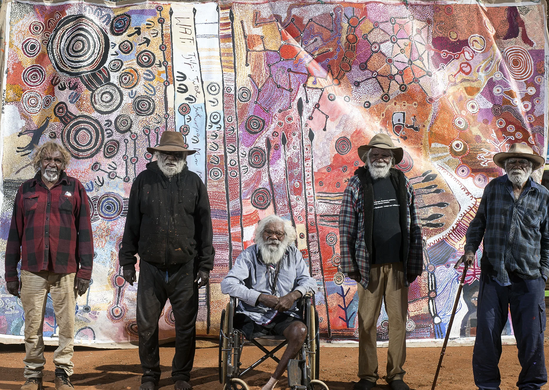 apy mEN'S collaborative 2016 WAS PAINTED BY 22 ARTISTS, INCLUDING (l-r) Ronnie dOUGLAS, bRENTON kEN, wILLY kAIKA bURTON, mICK wIKILYIRI AND rAY kEN (tJALA aRTS). iMAGE Rhett hAMMERTON.