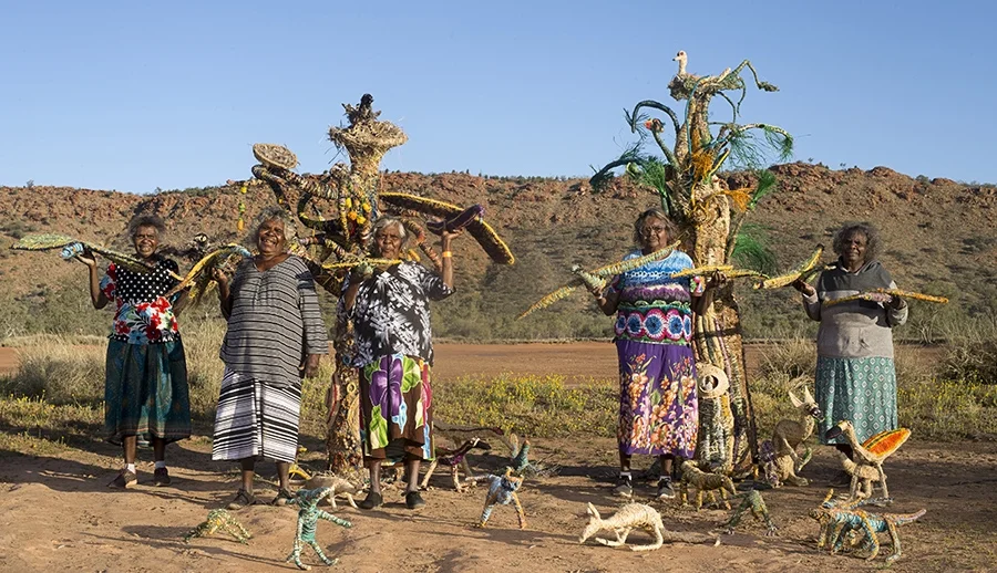 apy lands artist/tjanpi desert weavers collaboration punu kutjara - two trees 2016. L- R Mary katajuku pan, illawanti ungkutjuru ken, tjunkaya tapaya, Imiyari frank, niningka lewis. copyright tjanpi desert weavers, npy women's council