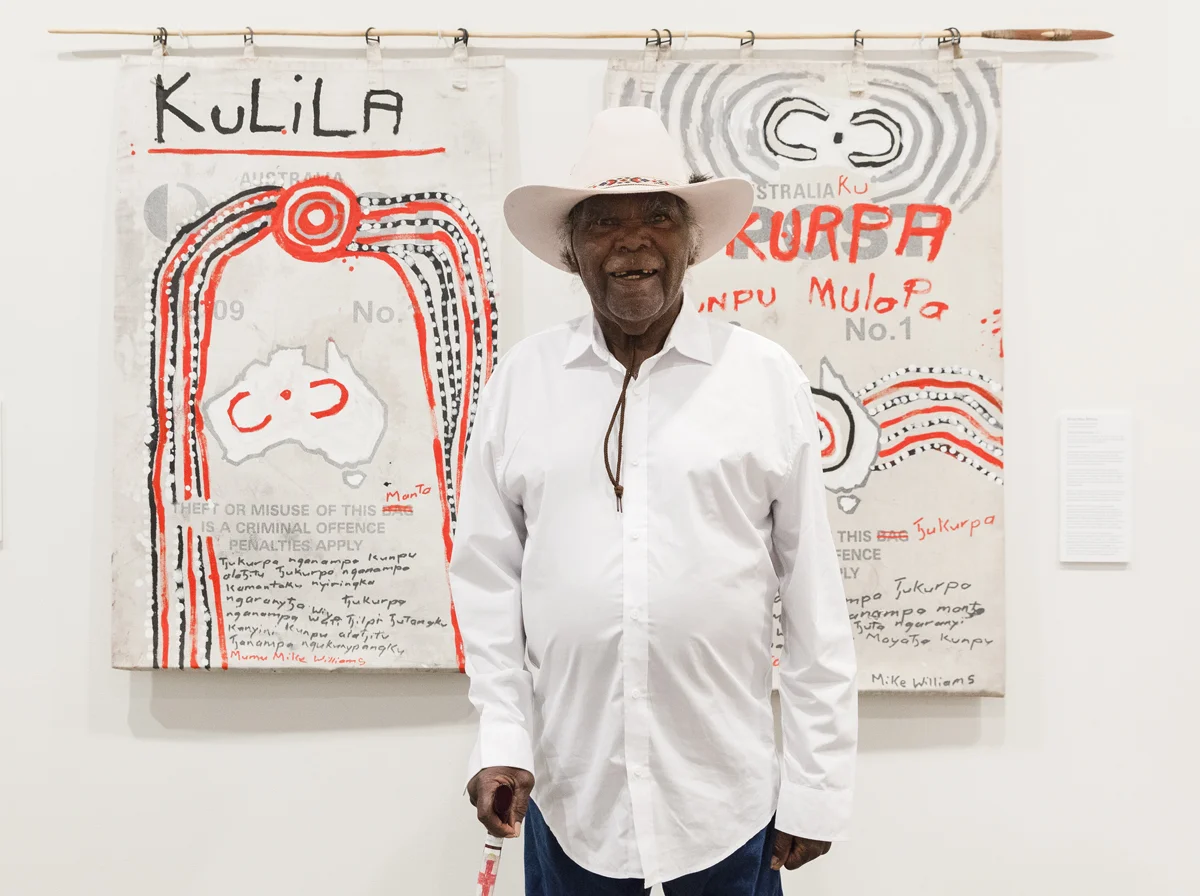 Mumu Mike Williams with his work 'Tjukurpa kunpu mulapa'