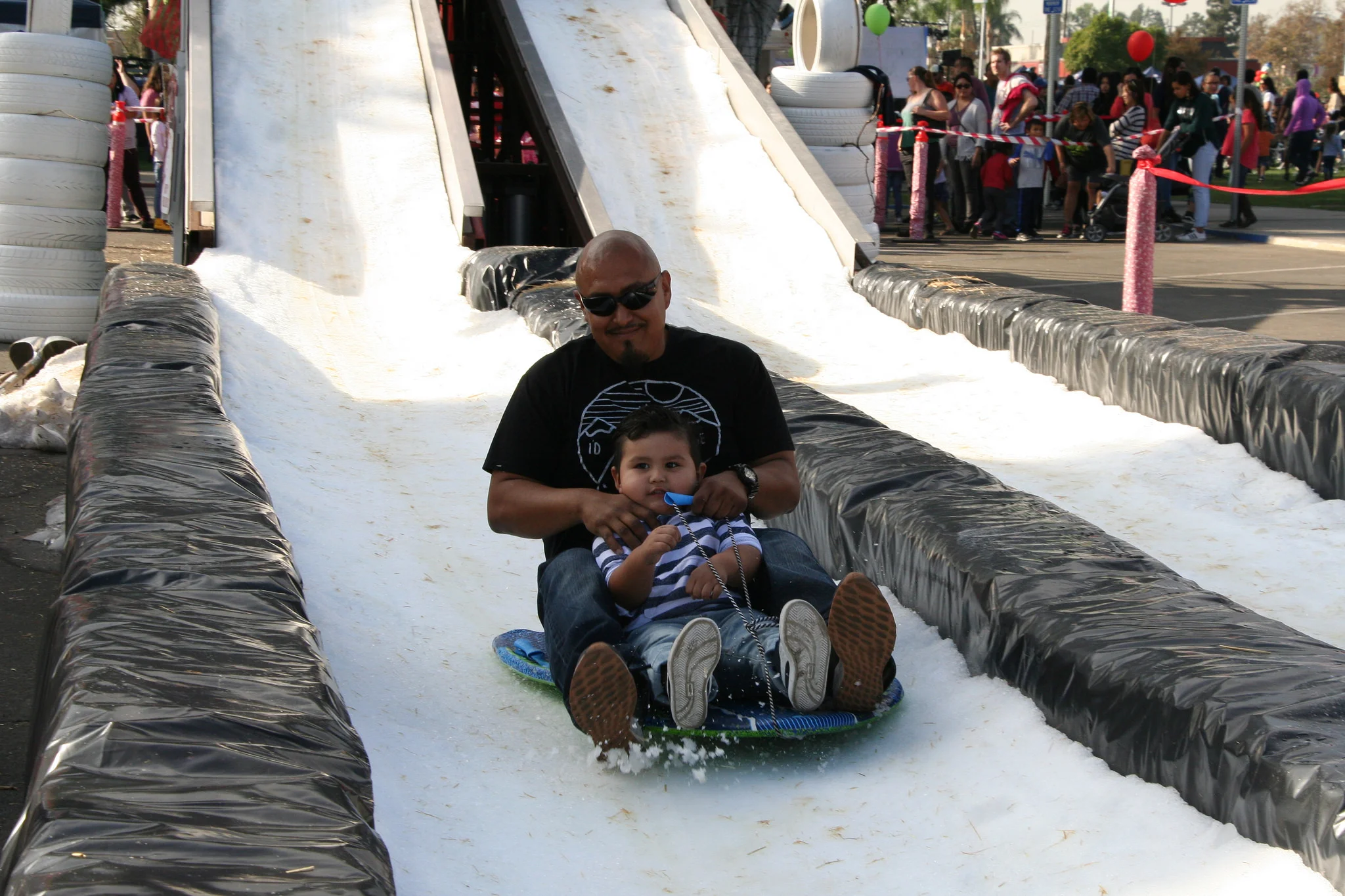 A real snow slide is a popular attraction at Norwalk’s SnowFest. Photo courtesy City of Norwalk