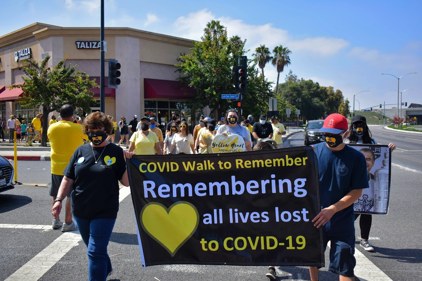 Norwalk community mourns COVID-19 victims during Awareness Day march