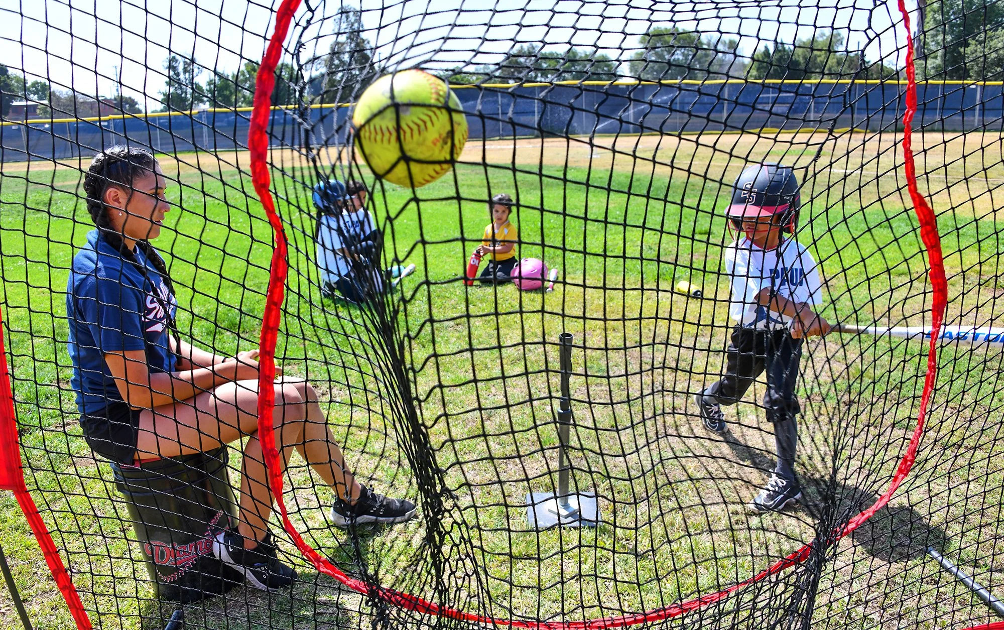 St. Paul softball players help train next generation of athletes
