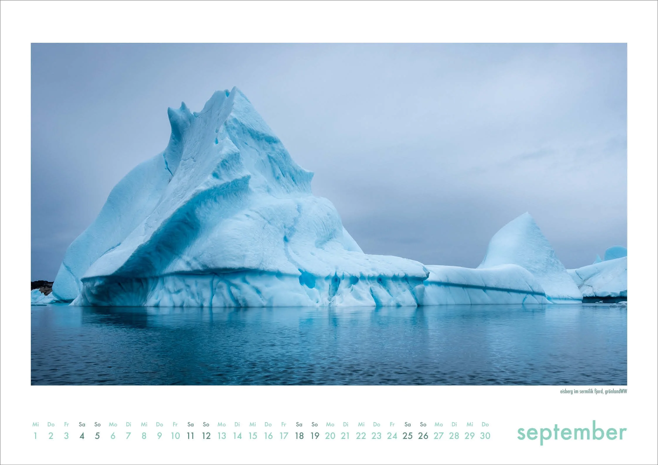Riesiger blauer Eisberg im Sermilikfjord, Grönland - Kalenderblatt September