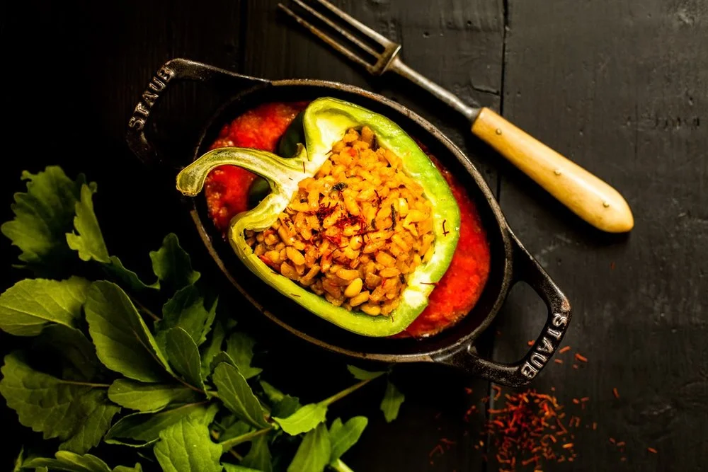 Peppers stuffed with rice, saffron, pine nuts and mushrooms