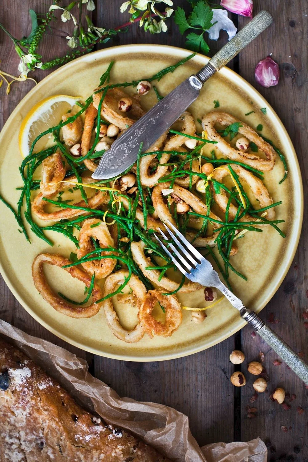Crispy squid with samphire, toasted hazelnuts and lemon