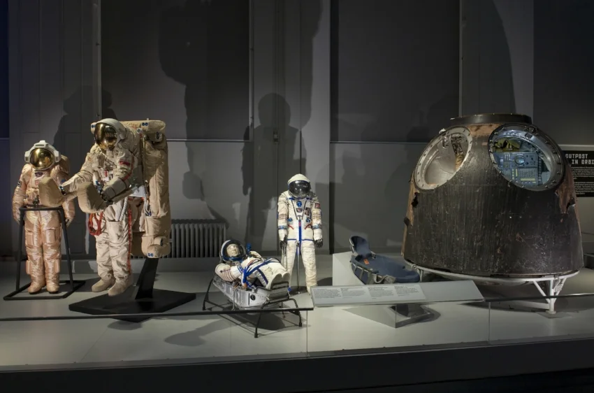 A selection of spacesuits and the TM-14 Soyuz descent module in the Cosmonauts exhibition