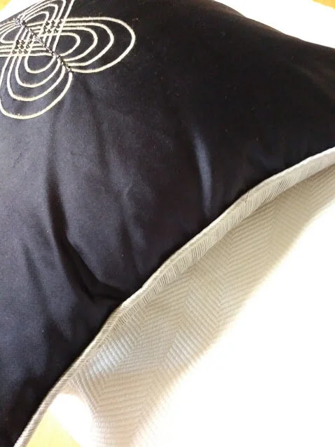 Detail of double embroidered heart design cushion.jpg