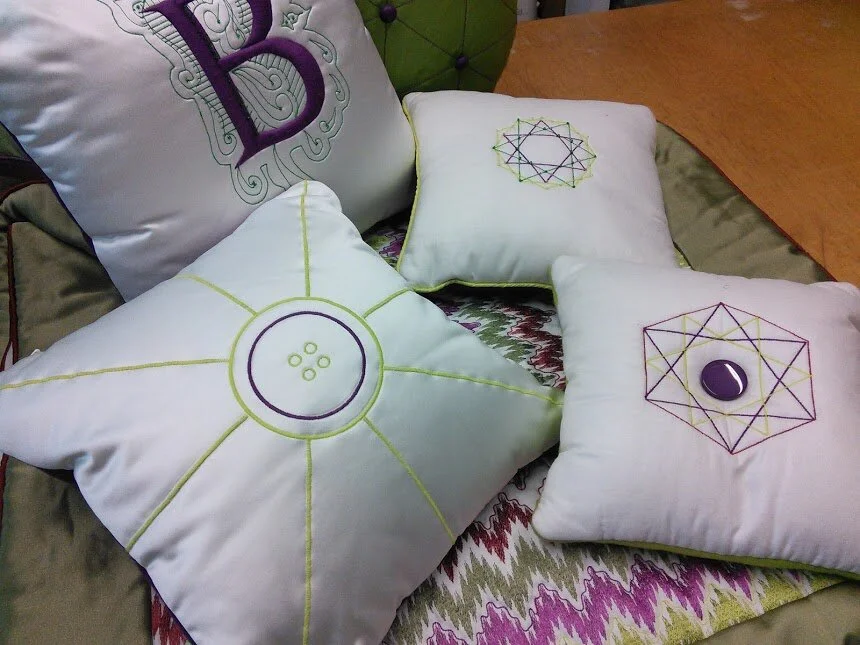 group of 3 small embroidered cushions.jpg