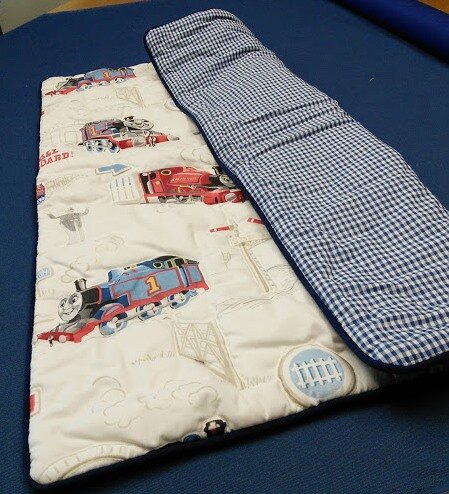 Check lined thomas cot quit piped.jpg