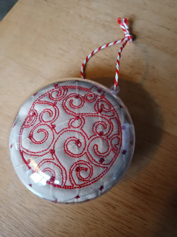 Cream red scroll bauble.jpg