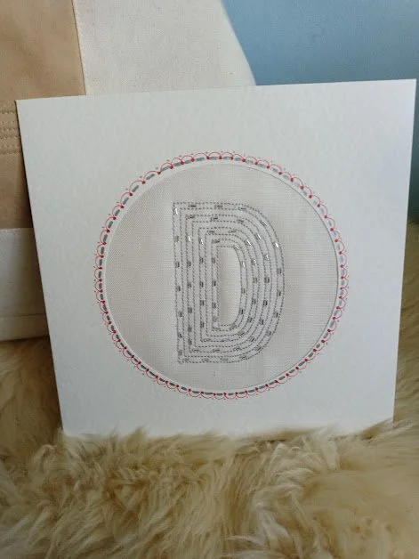 Silver D on linen.jpg