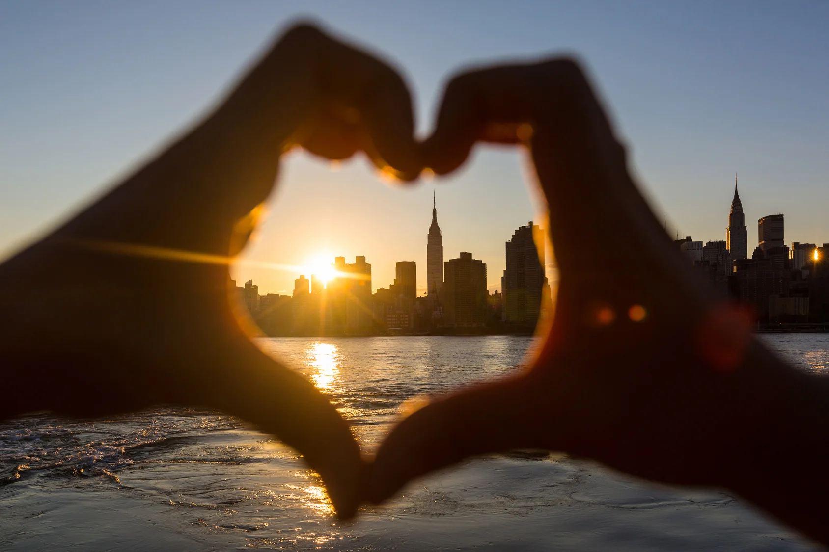 Heart shaped hands New York skyline.jpg