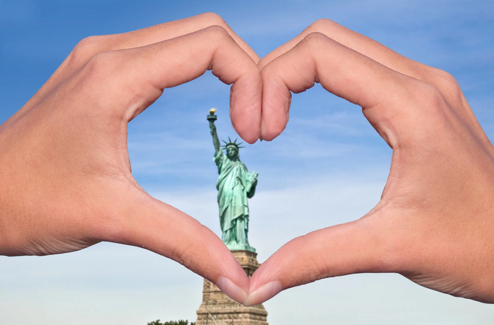 Heart hands around Statue of Liberty