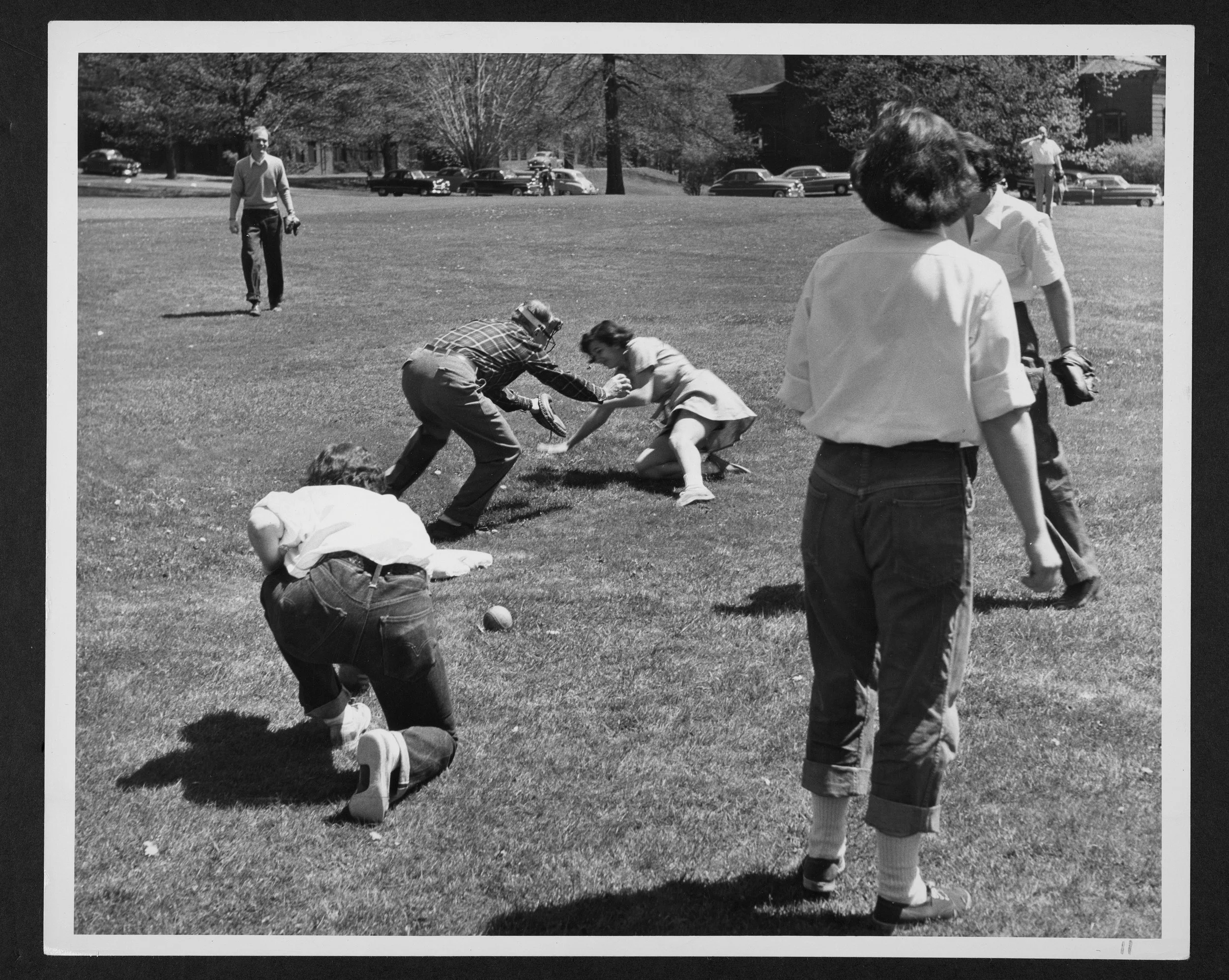 Family members playing baseball during 1957 Parents’ Weekend. 