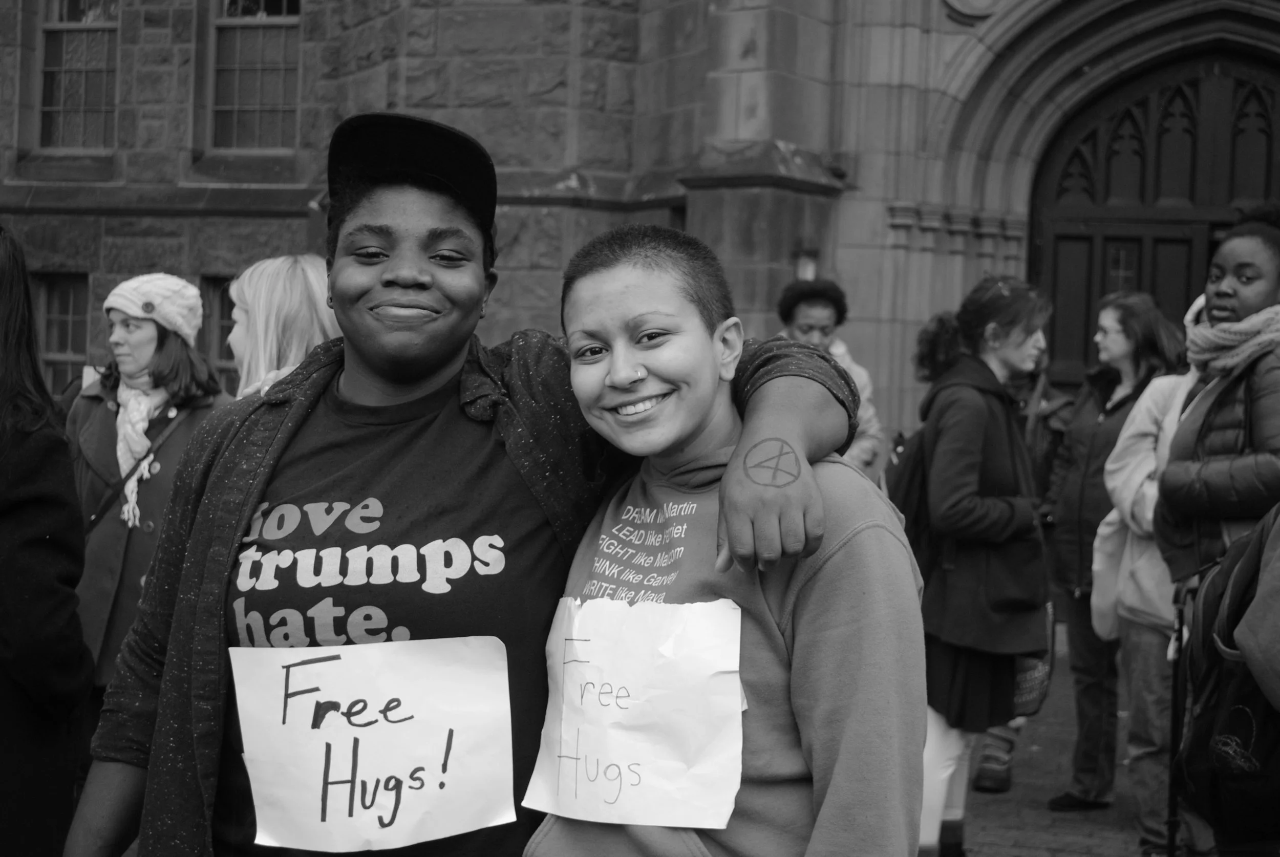 Photo by Leah Willingham '17 Shar Chuckas ’20 and Ela Pemmaraju ’20 wear Free Hugs signs in hopes of spreading positivity and compassion. on Nov. 9 2016.