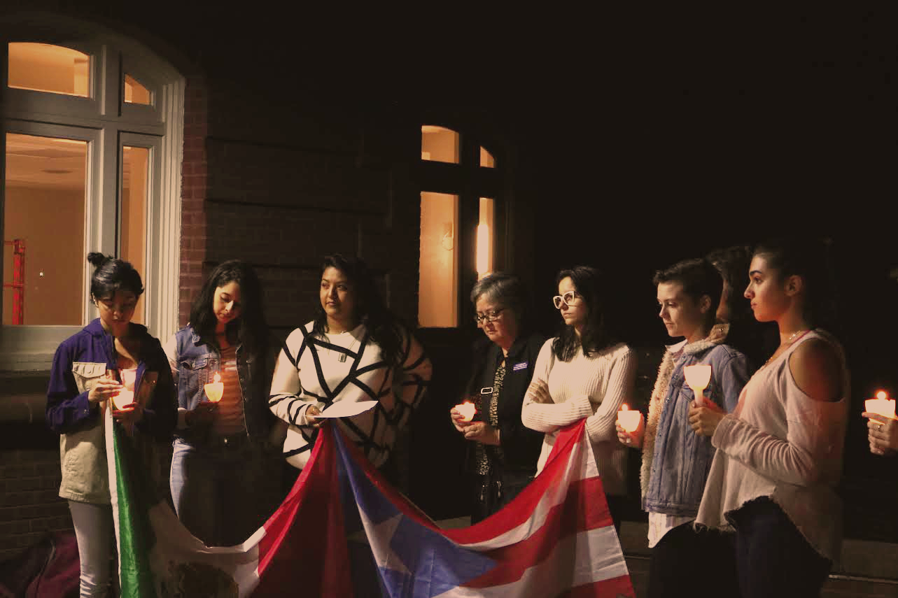 Photo by Dana Pan ‘20 Organizers from La Unidad and attendees of the vigil hold the flags of Puerto Rico and Mexico. The event was organized in response to natural disasters in the countries. 