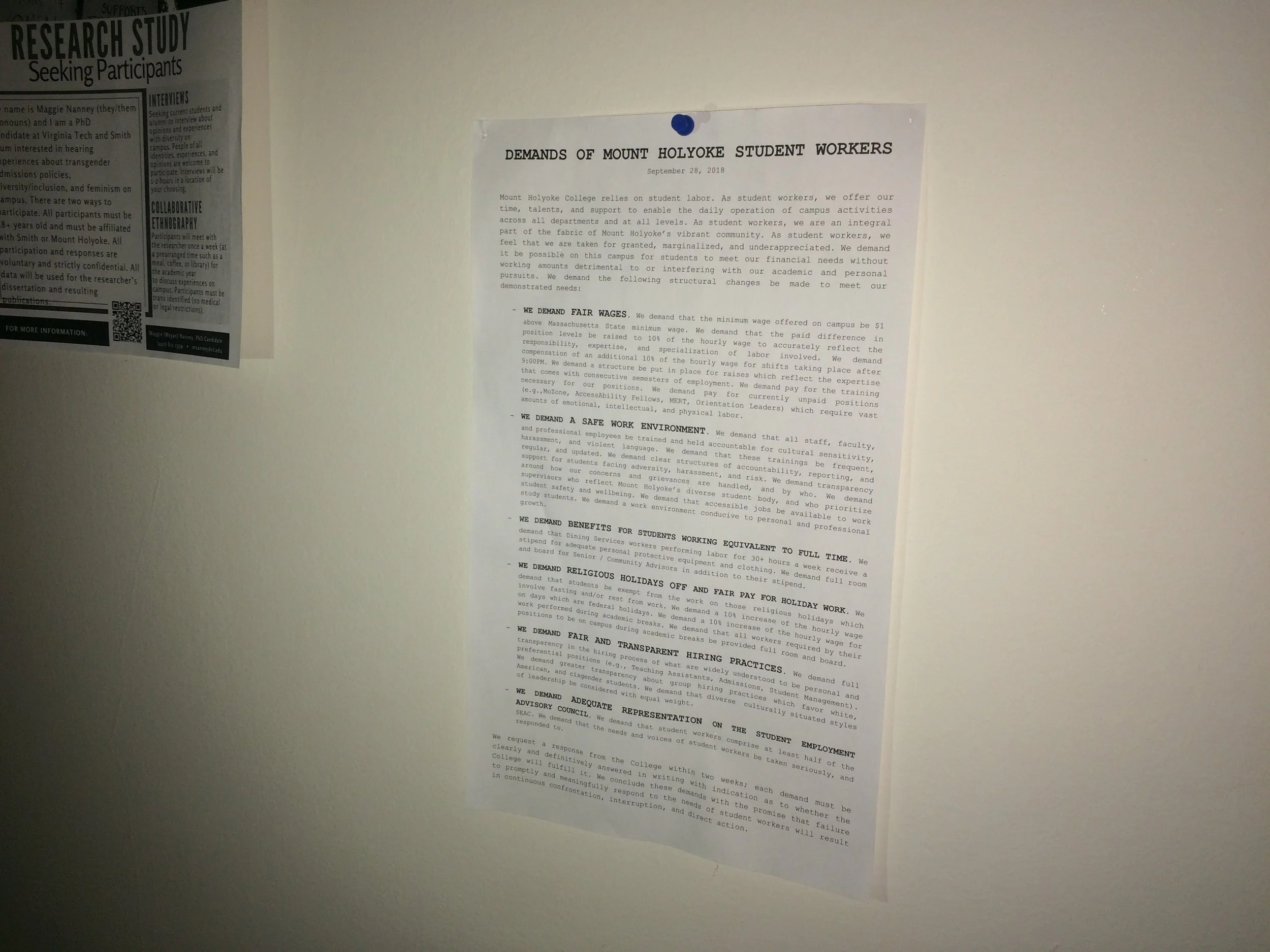 Photo by Allyson Huntoon ’19 Student organizers posted the demands of student workers in residence and academic halls around campus.