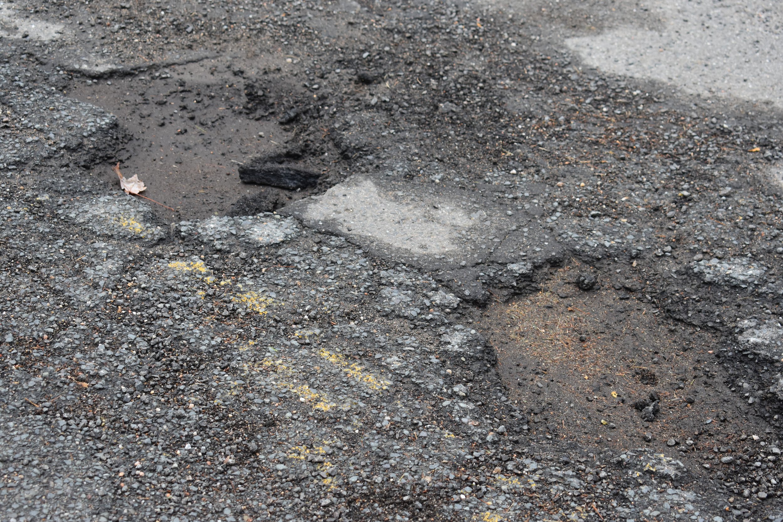 FEATURES_ potholes on Faculty Lane by Emma Quirk '26.JPG