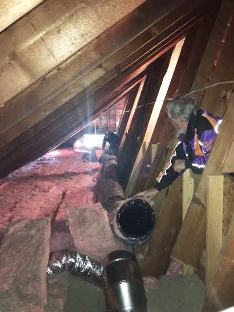 Joseph Arsenault, in the background, and Gordon McKenney prepare insulation at the Chocolate Church Arts Center in Bath. Arsenault is a volunteer contractor, and McKenney is a member of the board of directors.