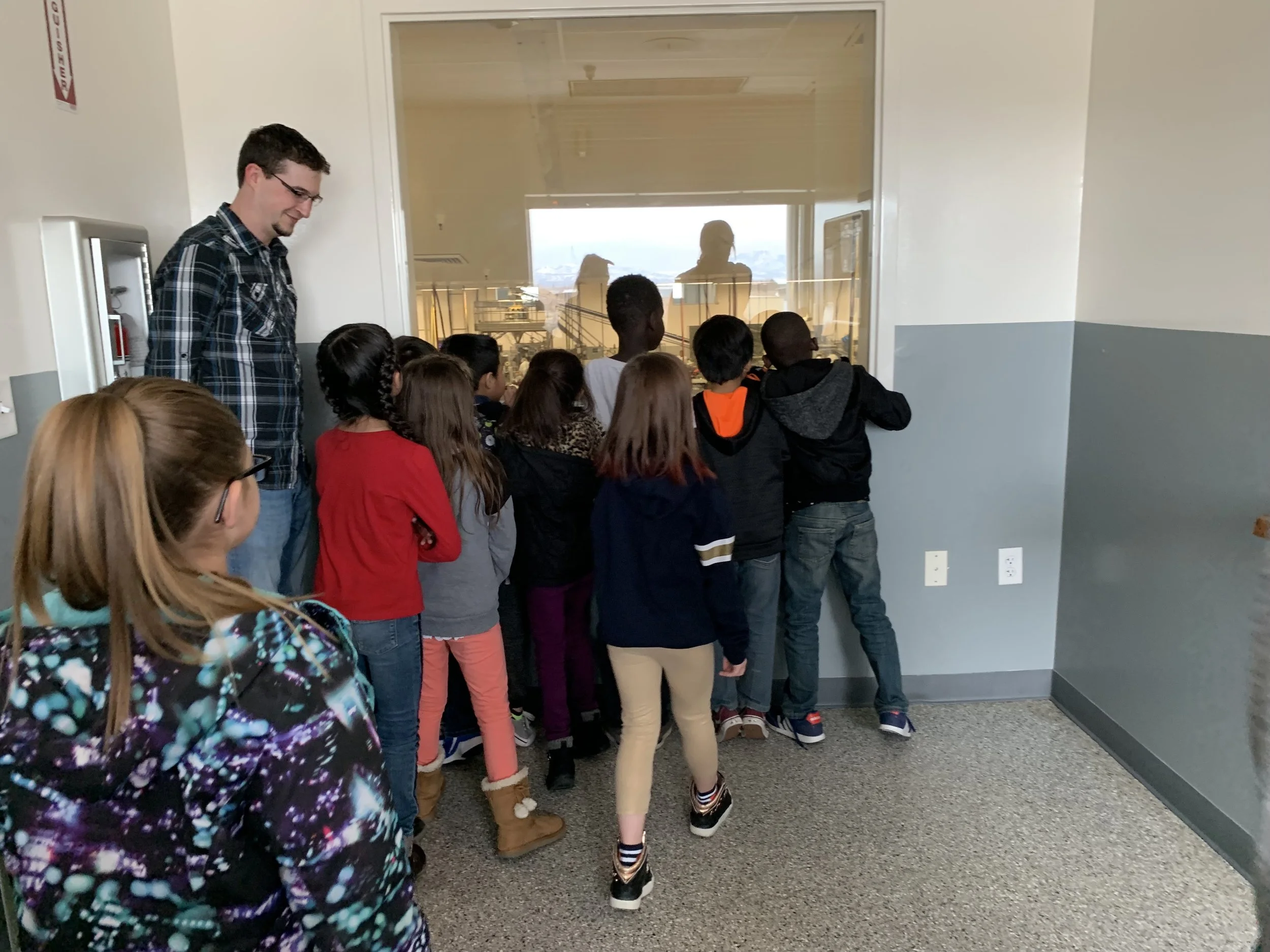 Gossners- Kids looking at machinery distance.jpg
