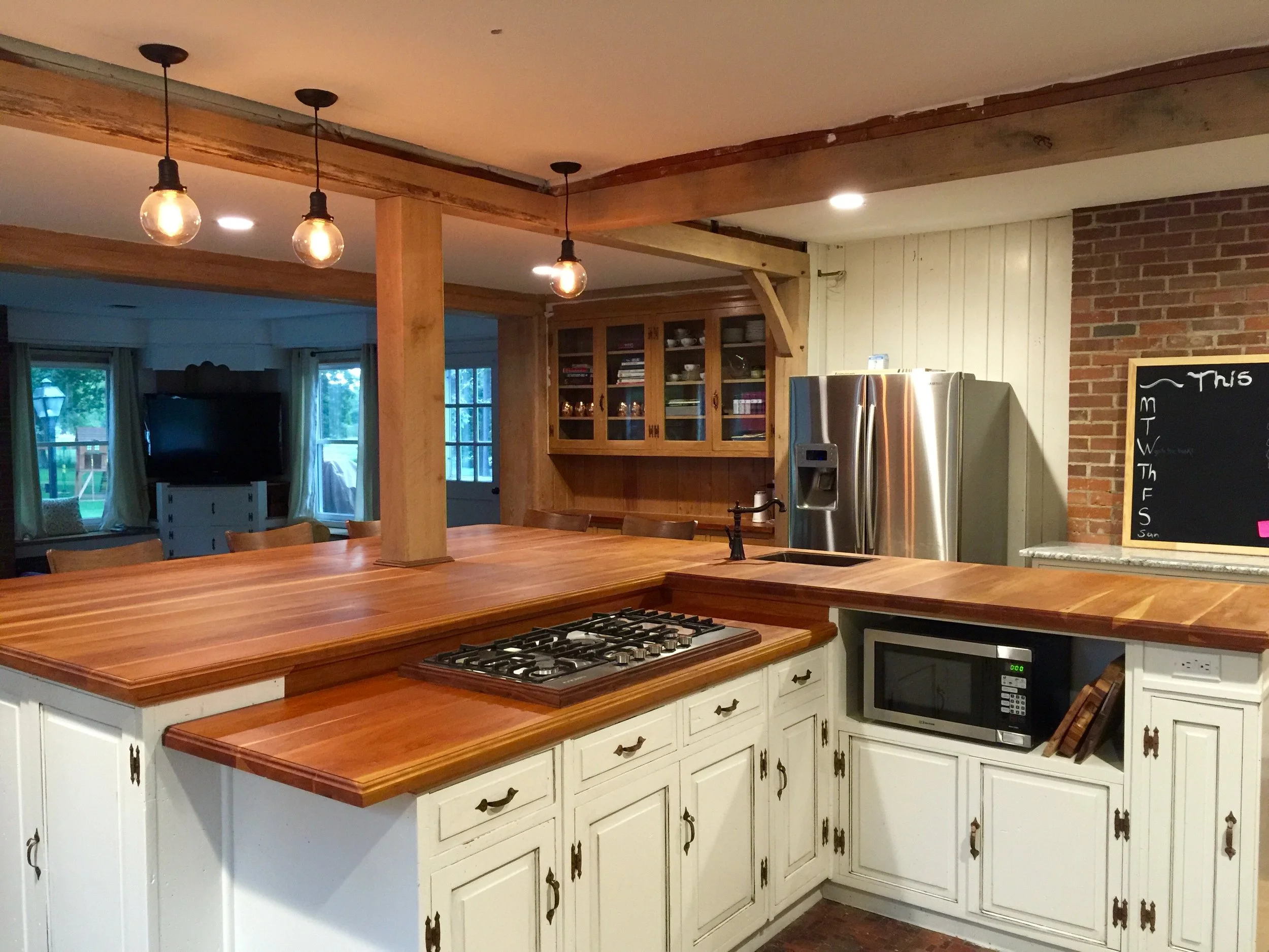 Kitchen remodel, custom island and cabinets, ceiling beams for opening up the room.