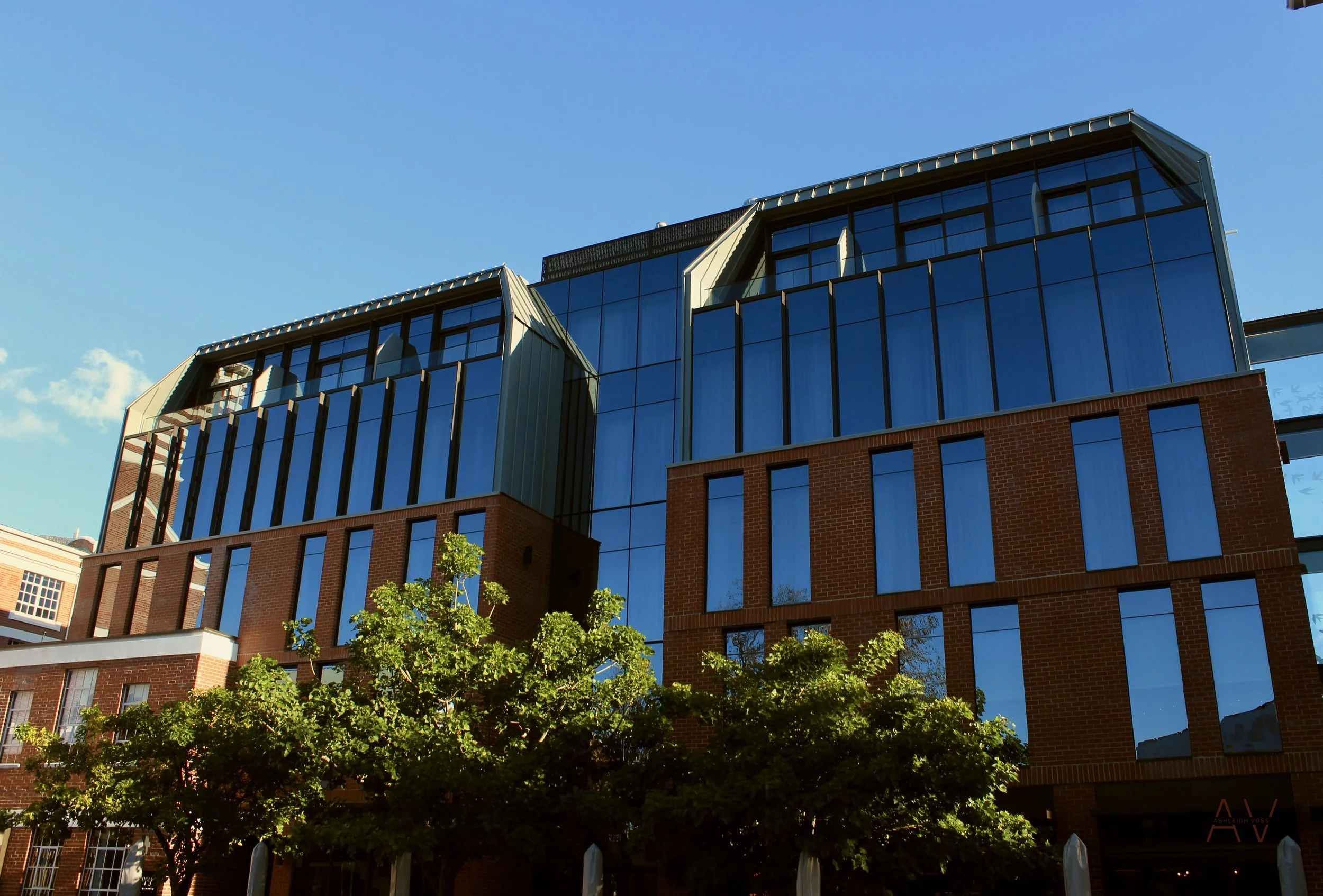  The project consisted of refurbishing five existing heritage buildings, while adding underground parking below and a new structure above and around. This new structure consisted of a complex mixture of concrete-masonry structure with a modern steel 