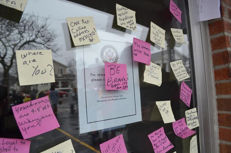 Protesters gathered outside of Representative Chris Collins’ office for the second week in a row to voice their disapproval of Collins’ work as a representative. These protests are supposed to continue weekly for the first 100 days of President Donald Trump’s term. Pictured left are rally attendees Brooke McCorkley and Pat Murphy. (Courtesy of Matt Leader and Ben Beagle)