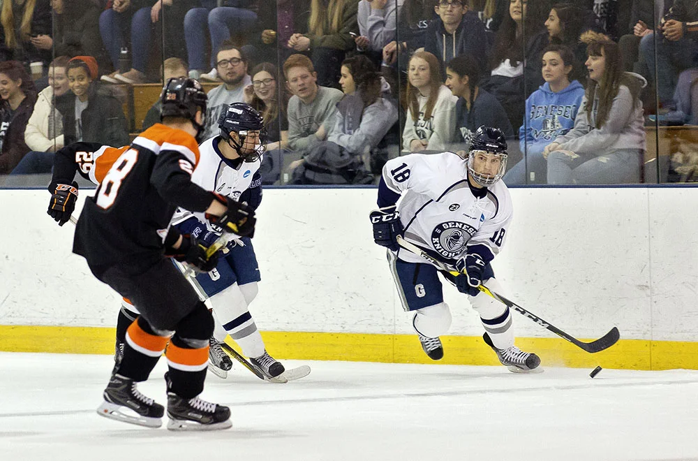 Senior forward Stephen Collins takes the puck to the net, skating by the Buffalo State Bengals defense. The Ice Knights took a 3-0 victory over the No. 12 Bengals on Saturday Feb. 11 at the Ira S. Wilson ice arena. (Annalee Bainnson/Assoc. Photo Editor)