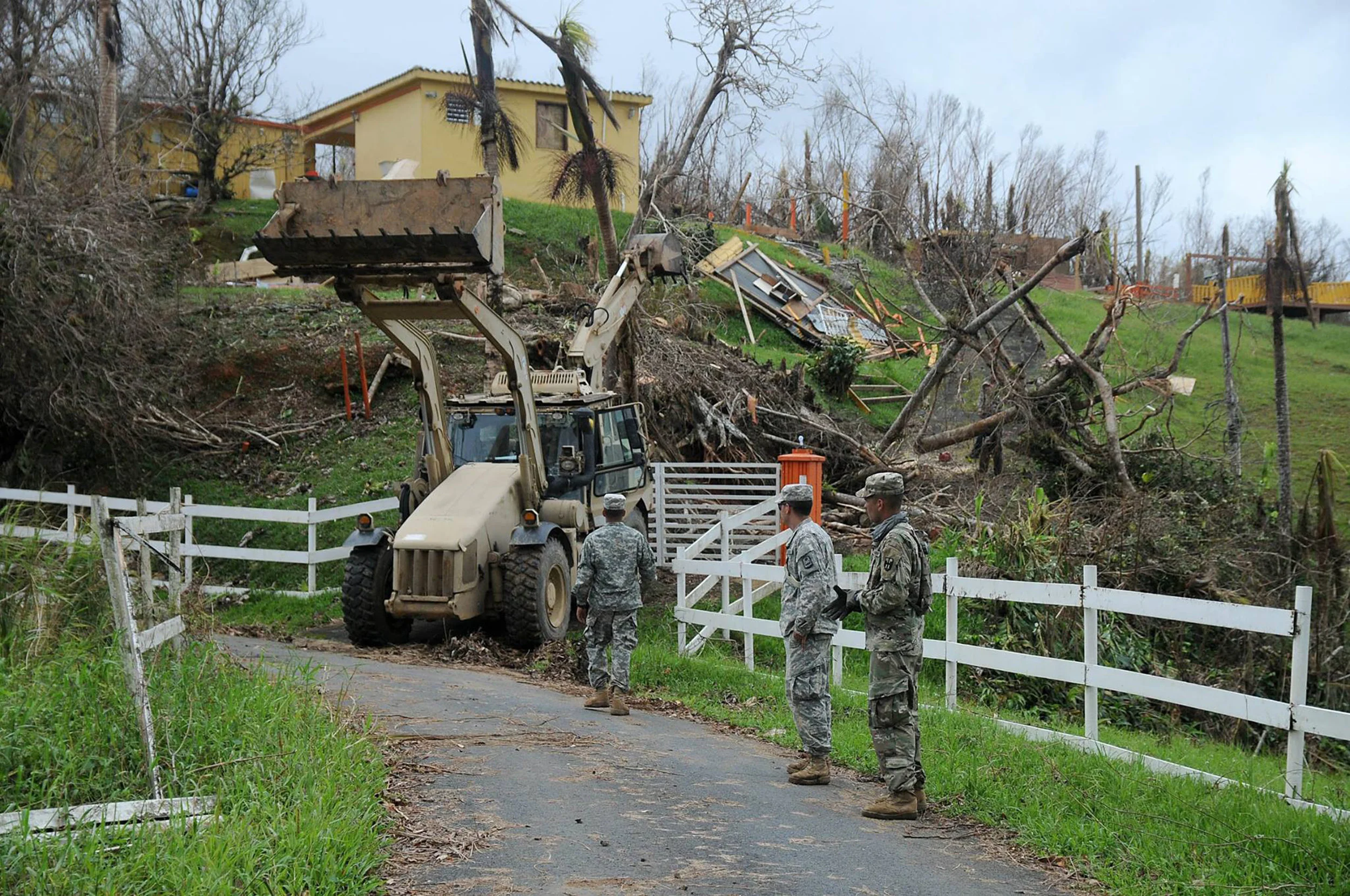 Members of the Puerto Rico Army National Guard are (pictured above) clearing an area in the municipality of Cayey, following Hurrricane Maria’s destruction. The SUNY system has decreased the tuition that Puerto Rican and Virgin Islander students will have to pay in order to mitigate their financial difficulties. (Wilma Orozco/Creative Commons)