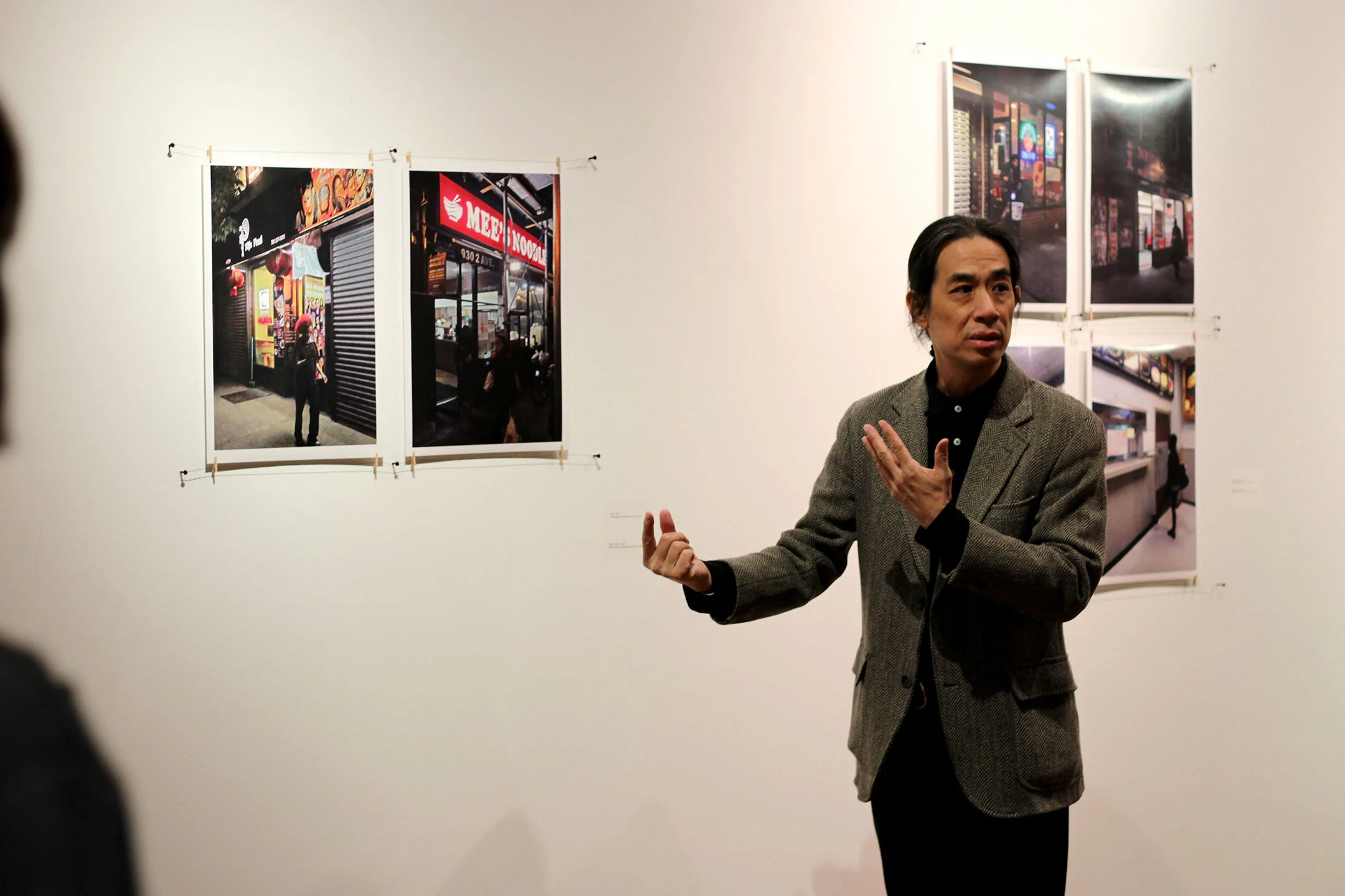 Chee Wang Ng (pictured left), a Chinese immigrant from Malaysia, featured his works in the Bertha V.B. Lederer Gallery on Oct. 25. His exhibit was called “Beyond a Bowl of Rice” and it explored Chinese culture. Ng caught the attention of the attendees with his distinctive views on Chinese traditions and ways of life. (Ellayna Fredericks/Assoc. Photo Editor)