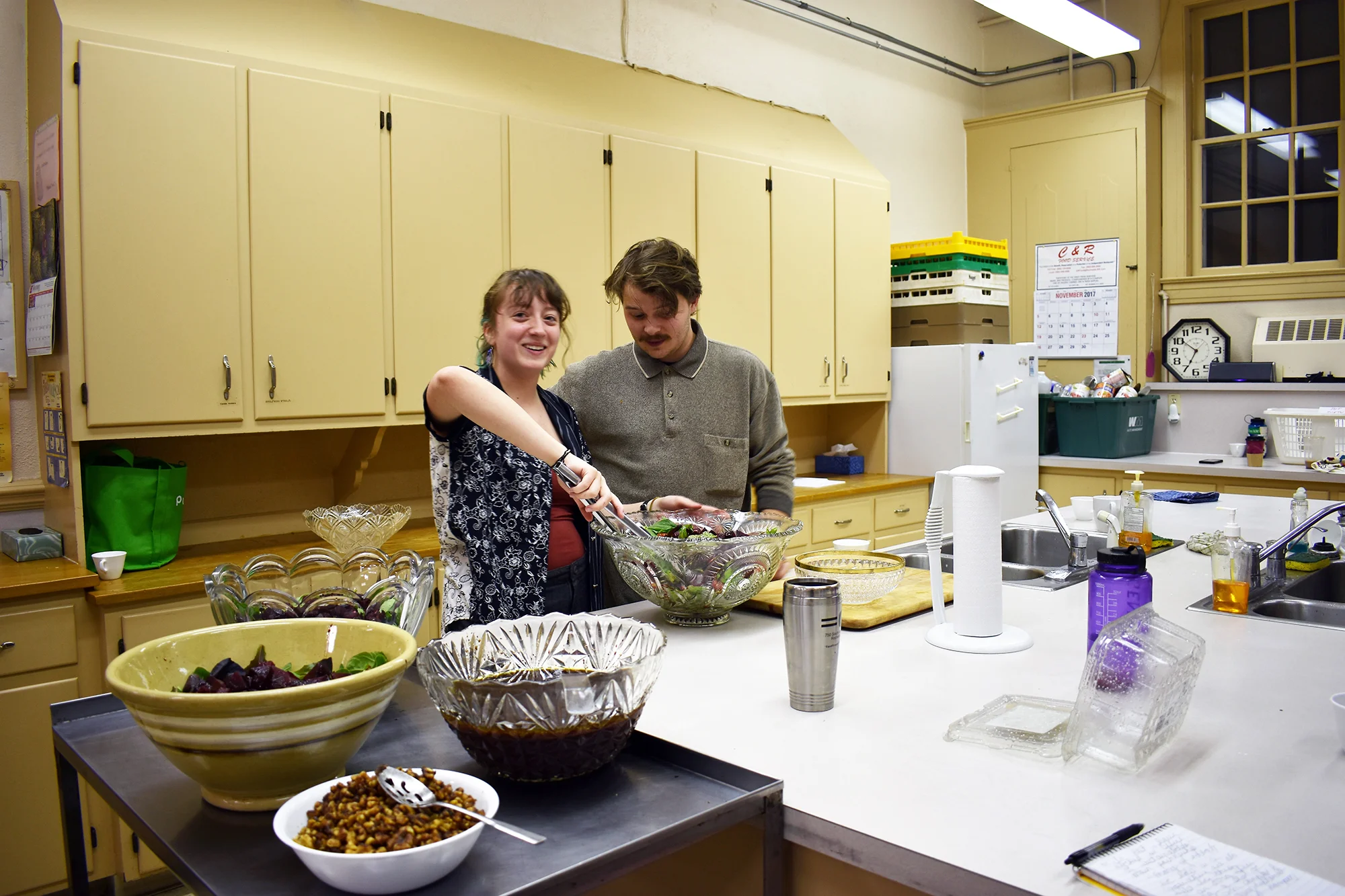 Theater major junior Lila Klatz (pictured left) and English major senior Nolan Parker (pictured right) preparing for the fall community dinner in the Central Presbyterian Church kitchen on Saturday Nov. 4. The dinner also featured a coat drive for migrant workers. (Izzy Graziano/Knights’ Life Editor)