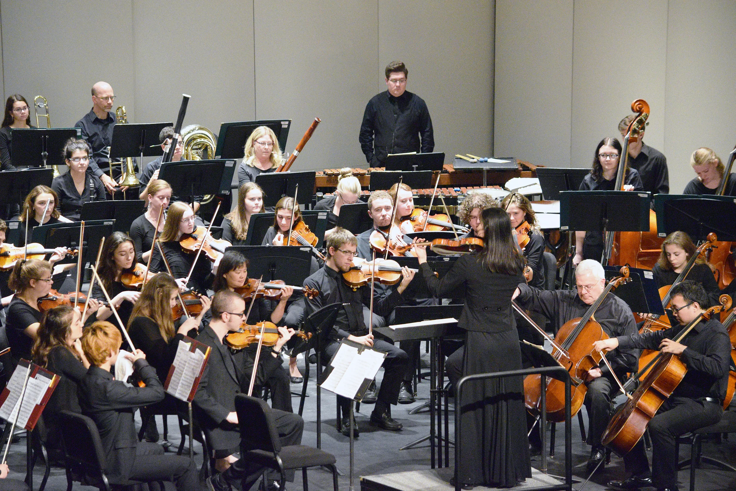 The Geneseo Symphony Orchestra performed on Sunday Oct. 14 in Wadsworth Auditorium. Leah McGray conducted the orchestra as they played a multitude of pieces by composers such as Franz Schubert, professor of music James Walker and Edvard Grieg. (Elijah Reed/Staff photographer)