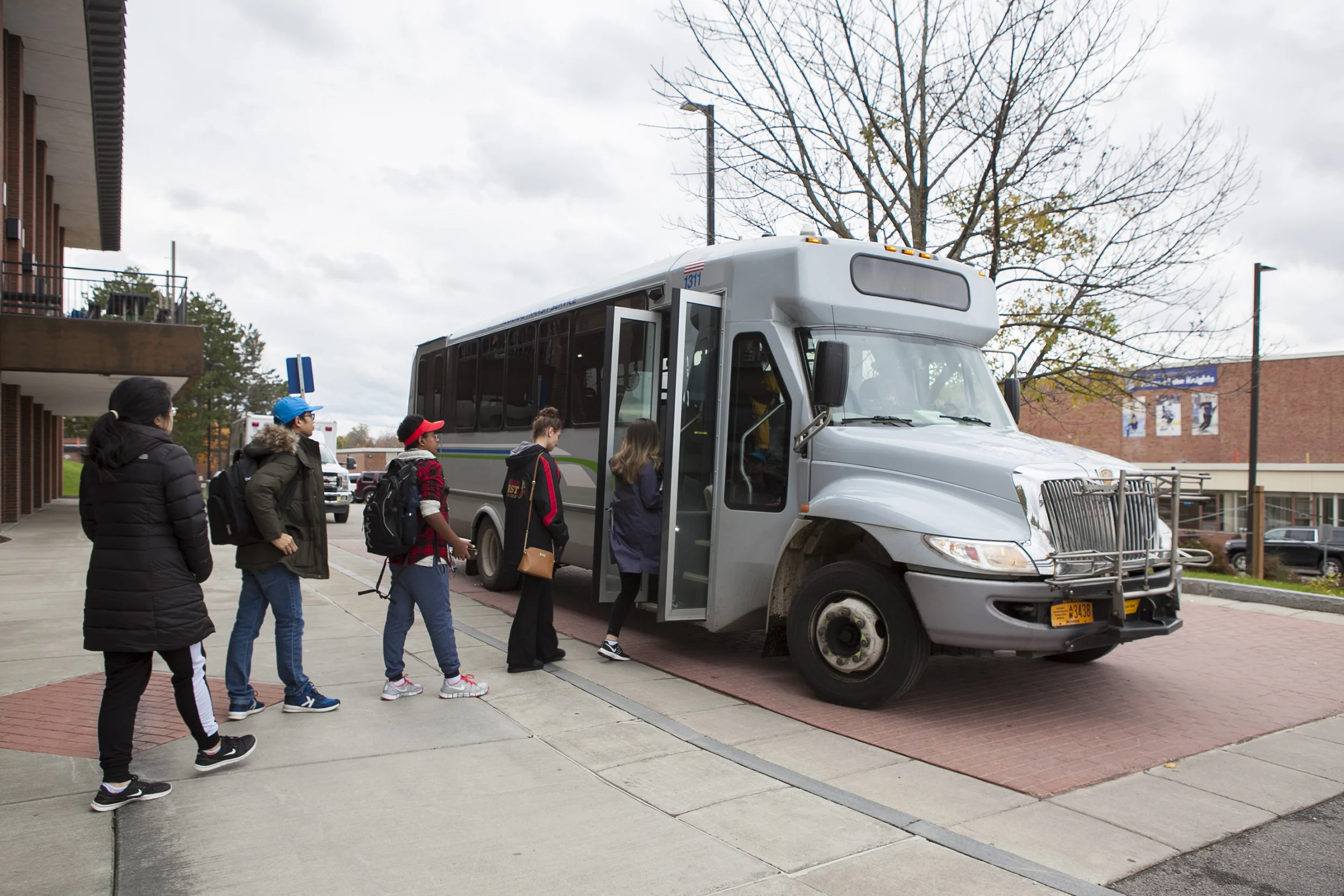 Students boarding a local bus (pictured above) that goes to various locations on and off-campus during the academic year, including Walmart and Wegmans. Communications major senior Udeshi Seneviratne, an international student from Vietnam, started a Geneseo Speaks petition calling for the college to offer transportation to students staying on campus during breaks (Udeshi Seneviratne/photo editor).