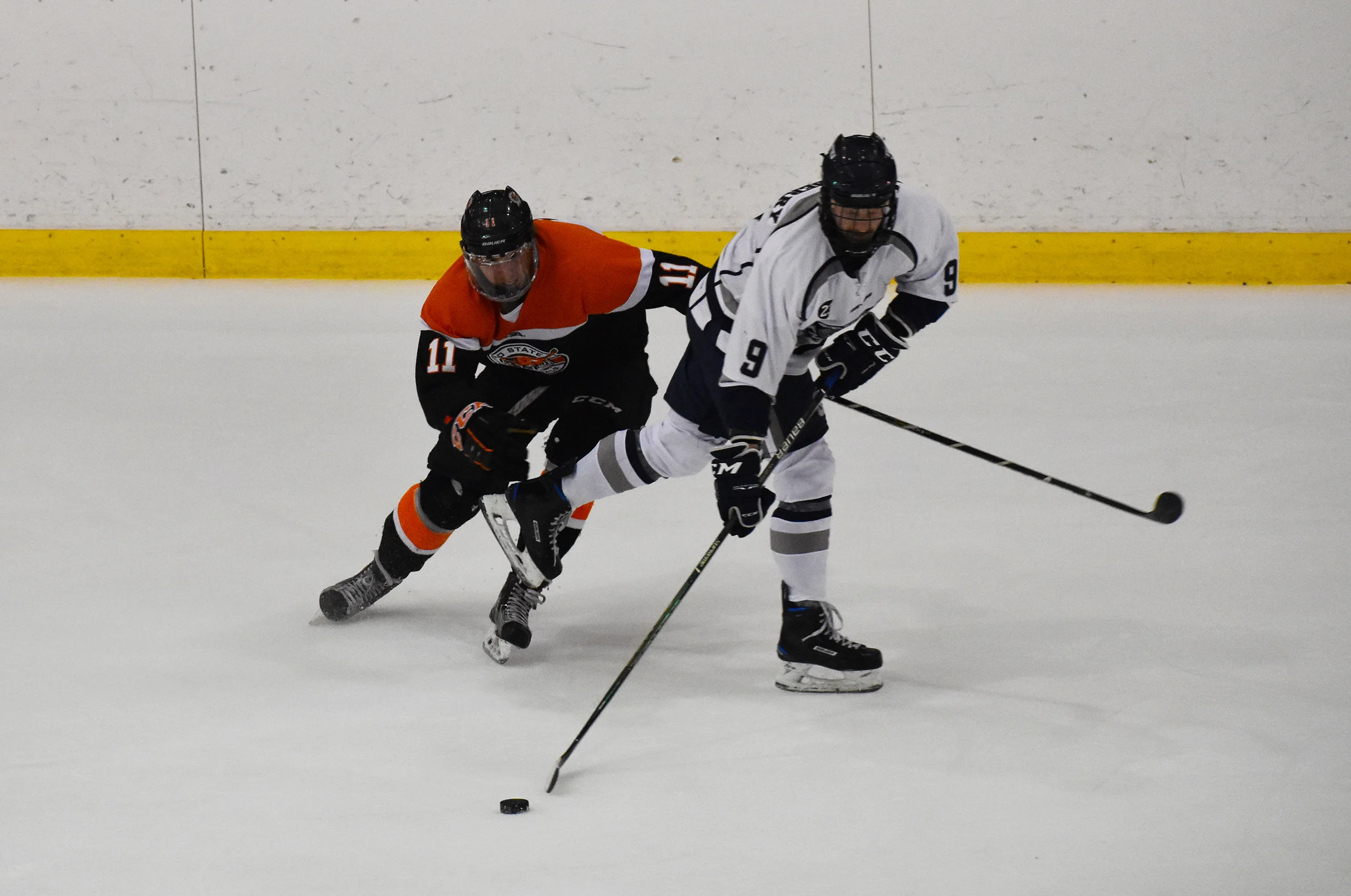 Junior defender Tanner Salsberry fends off an opponent in the team’s game against Buffalo State on Saturday Nov. 3. The game ended in a 4-4 tie after three full periods of play and five minutes of overtime (Josie Kwan/assoc. photo editor).