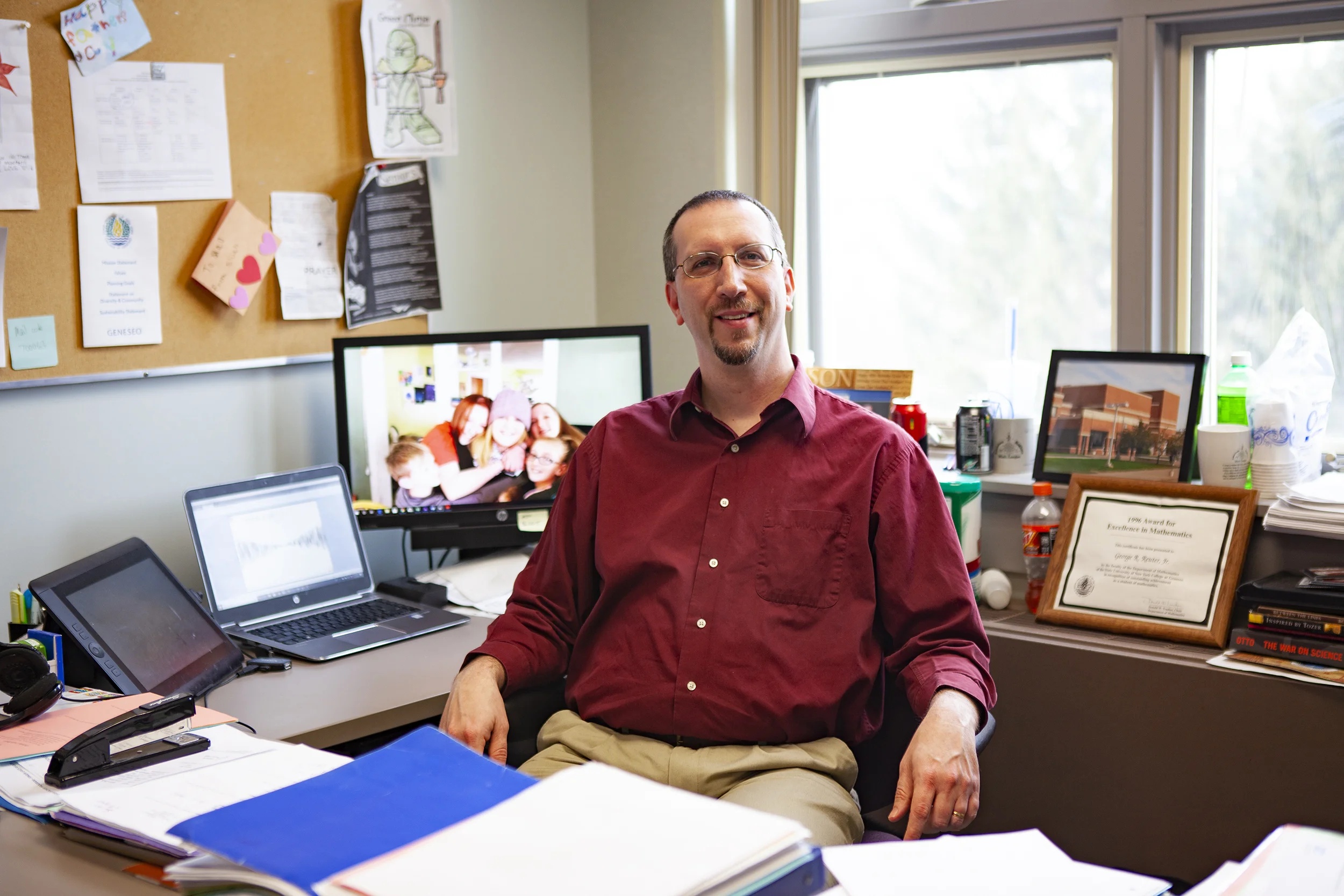Geneseo alumnus George Reuter ‘96 (pictured above) became a teacher at Geneseo Central High School following graduation. In 2013, Reuter returned to his roots and became a mathematics professor at Geneseo where he practices his unique teaching style focused on engaging students (Udeshi Seneviratne/photo editor).