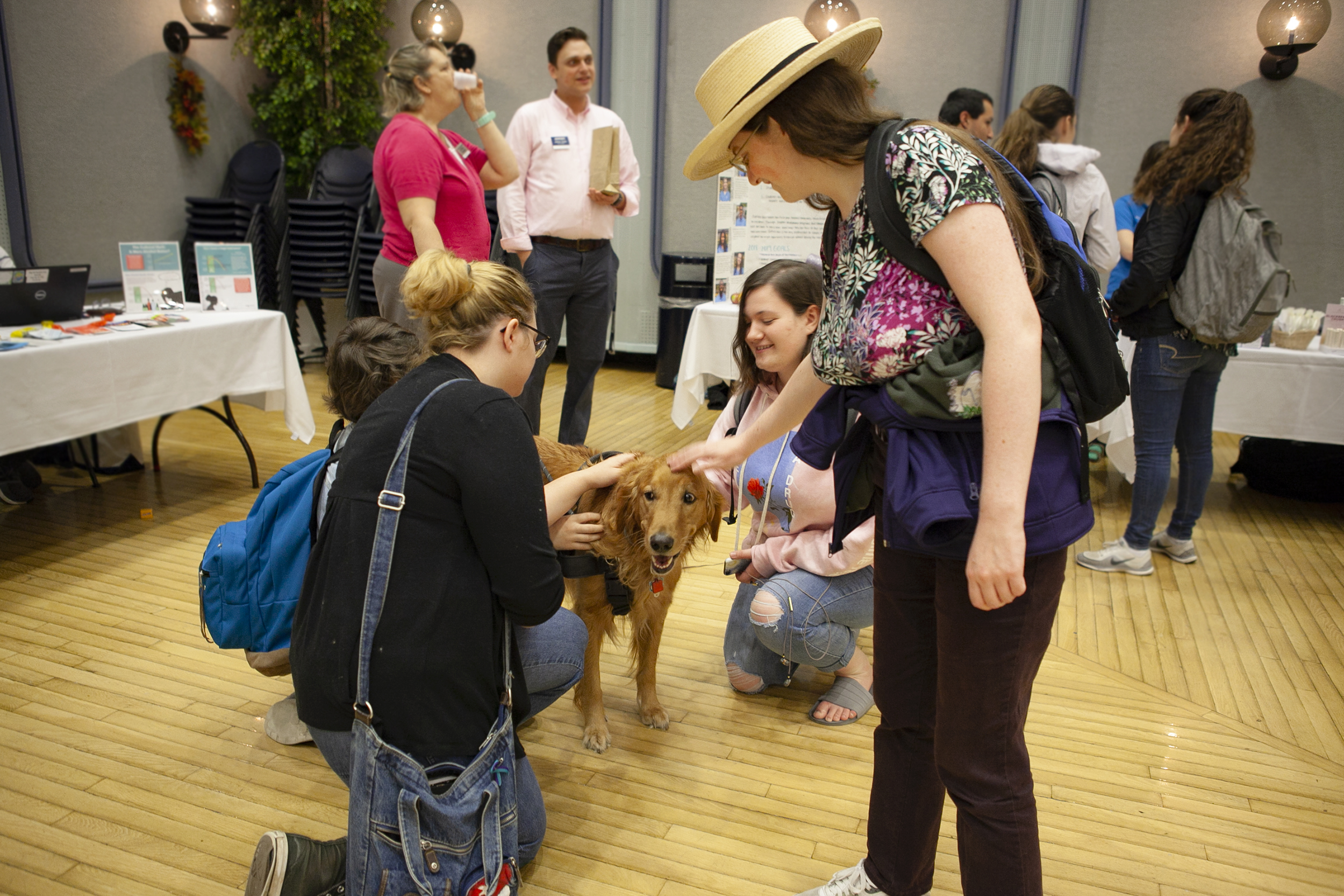 Recent changes in the leave of absence policy were inspired by the Jed Foundation, a non-profit mental health group, who evaluated the college’s mental heath services. The college hosts therapy dog sessions where students can pet and cuddle with the dogs to relieve stress (Udeshi Seneviratne/ photo Editor).