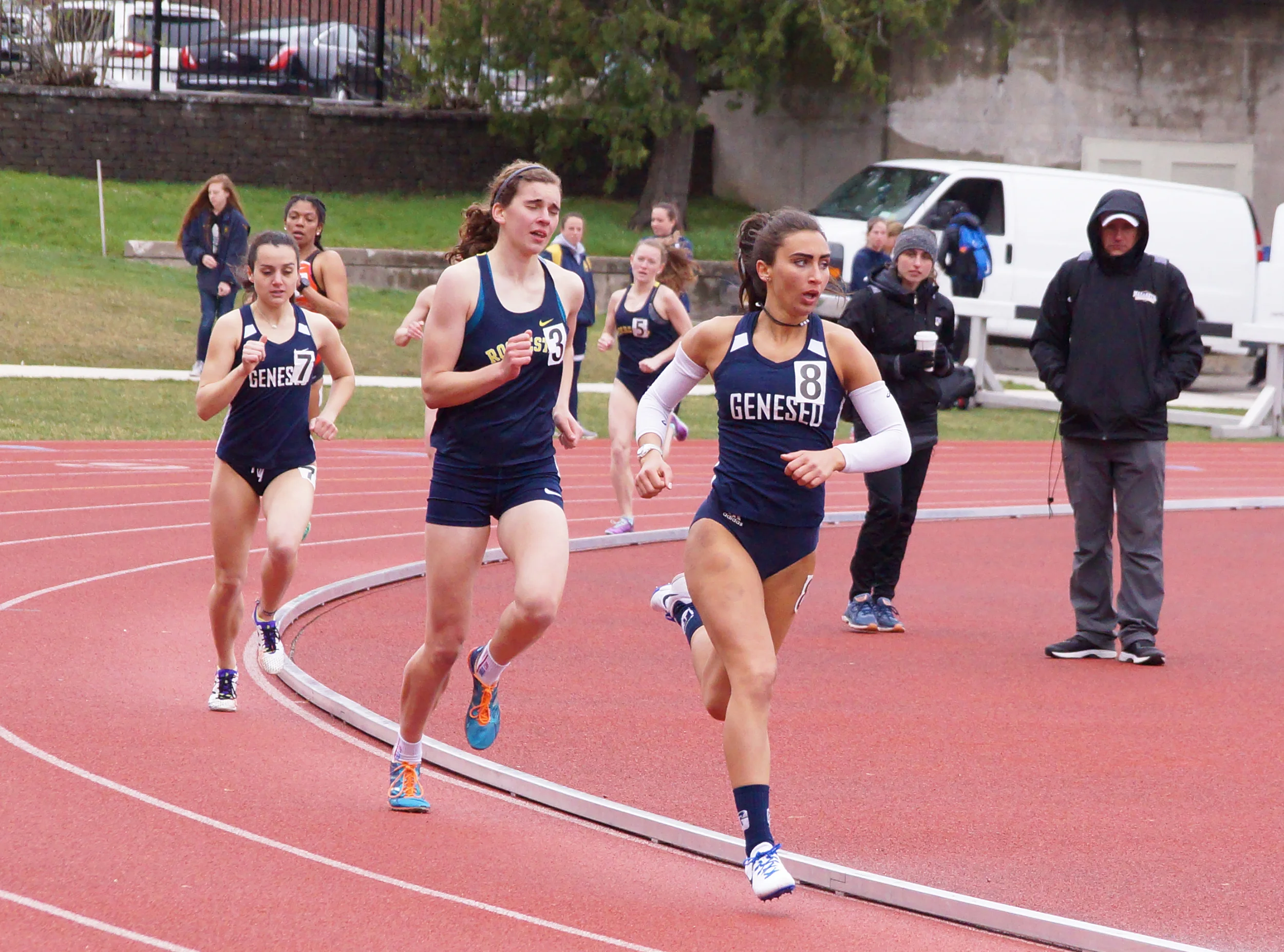 Sophomore sprinter Angela Calabrese (left) and senior mid-distance runner Julianna Lauricella (right) compete in the open 800 at the Rochester Spring Classic. Lauricella placed fifth in the event (Kara Burke/News Editor).