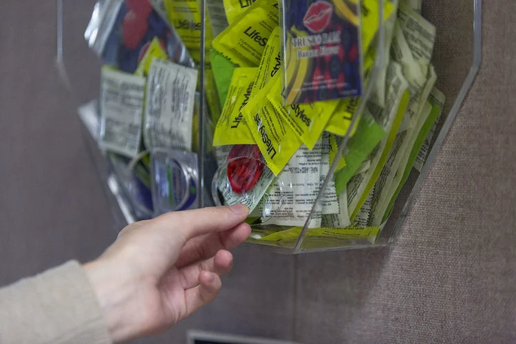The Lauderdale Health and Counseling Center has a station where students can pick up different male and female condoms. These safe sex tools are also available other places on campus, including the residence halls (pictured above) (Annalee Bainnson/Former photo editor).