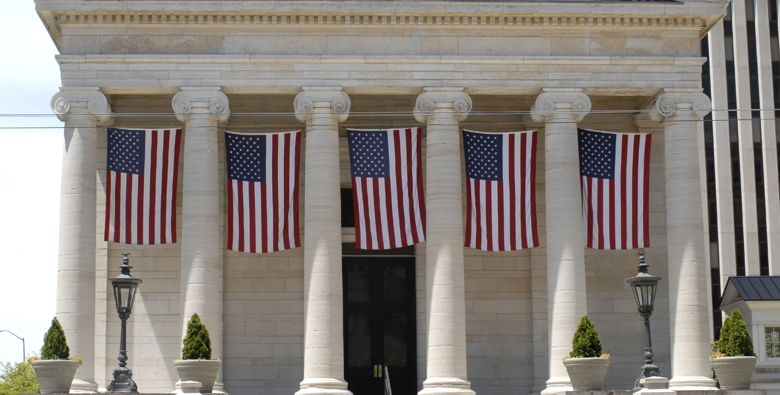 bigstock-Old-Court-House-with-Flags-10405028.jpg