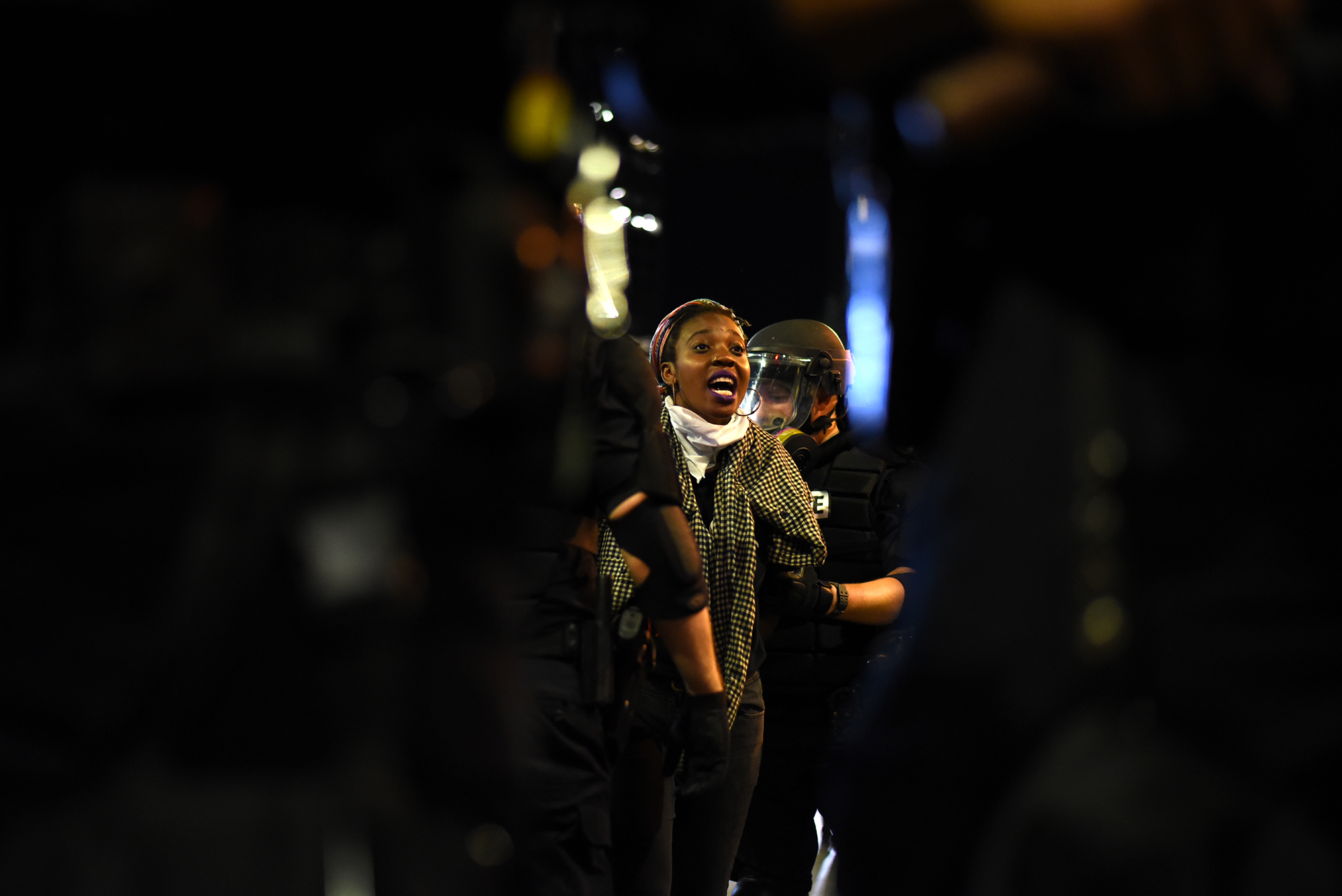 A protestor shouts at riot police officers in Charlotte, North Carolina, USA, 21 September 2016. North Carolina governor Pat McCrory declared a state of emergency after protesters took to the streets of Charlotte, North Carolina, for the second cons