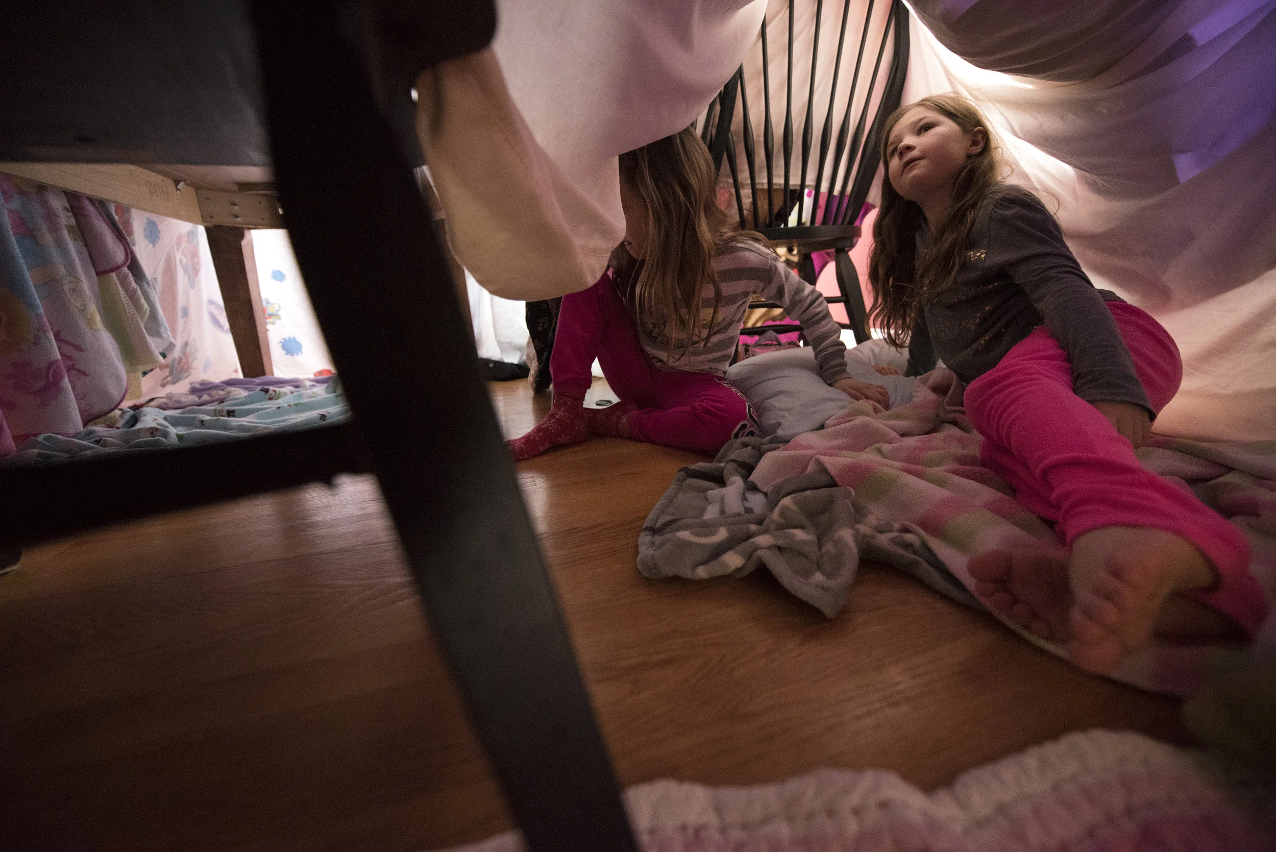  Sophie Wade, 7, right, looks up into her fort as sister Ava, 9, heads toward the kitchen of the fort inside their Henderson home on Tuesday, January 10, 2017. &nbsp;   